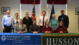 members of Husson and WCCC at signing ceremony
