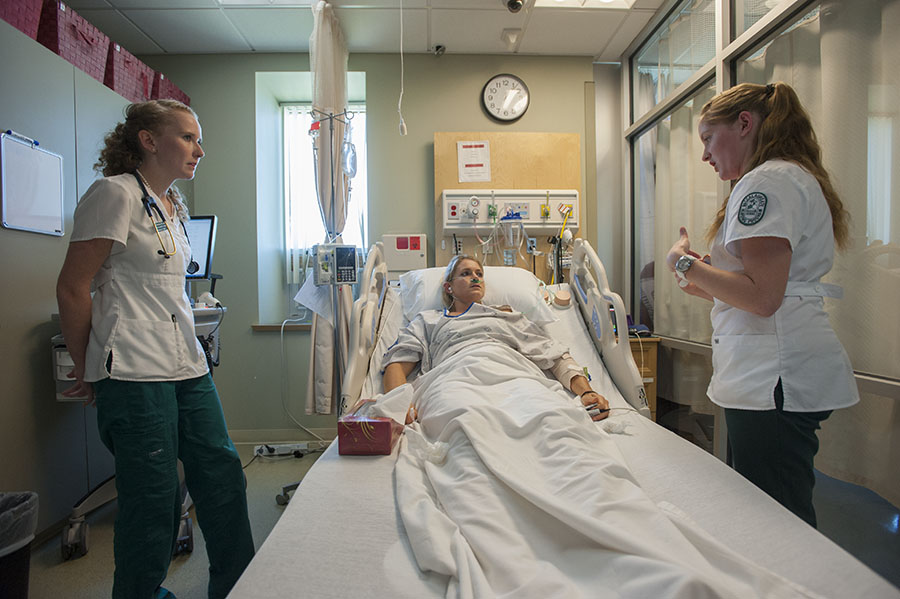 Students work in the Nursing Simulation Lab during a interdisciplinary exercise.