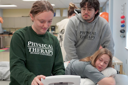 physical therapy students work in a muscle lab