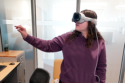 An Extended Reality program student uses the new Apple Vision Pro Goggles