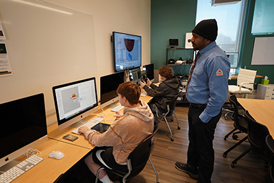 A student in the Extended Reality program in the School of Technology and Innovation at Husson University works on software for the Apple Vision Pro