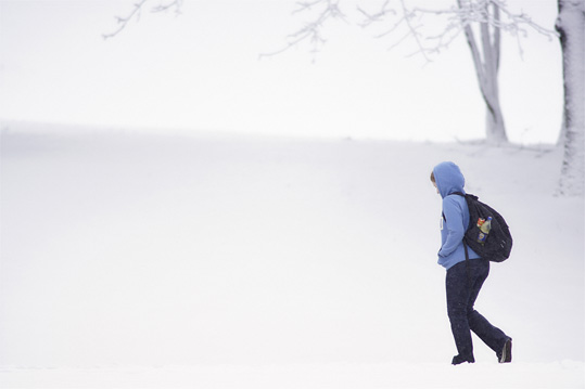 Student walking in snow