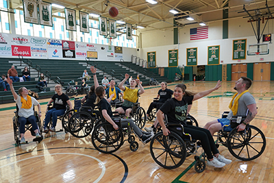 People playing basketball in wheelchairs.