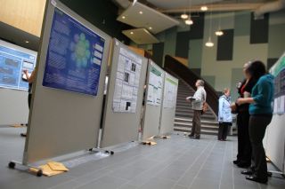 students and faculty in Gracie Theatre atrium