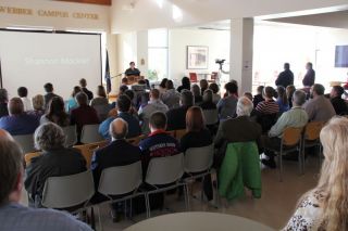 individuals seated for moment of silence