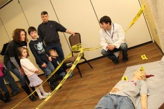 simulated crime scene investigation with on lookers
