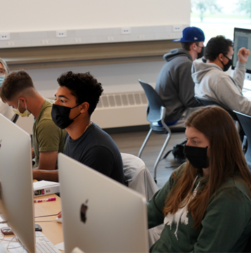 students work on computers in a lab