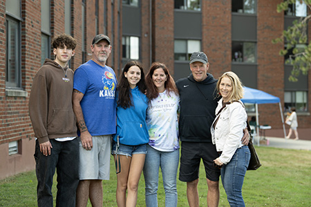 familes stand in front of the residence halls during move-in weekend