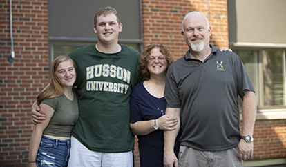 Parents meet with a student on move-in day