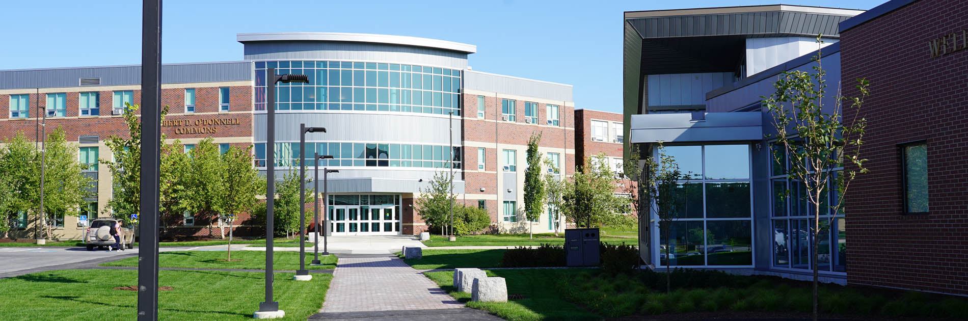 Students walking on campus of Husson University