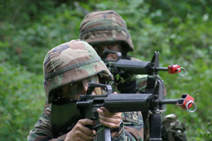 An image of two soldiers out in the field.