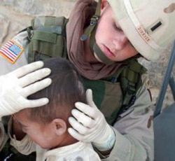 An image of a nurse working with an injured child.