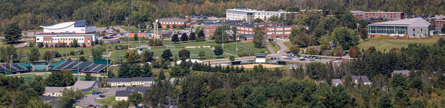 Students taking picture on campus of Husson University