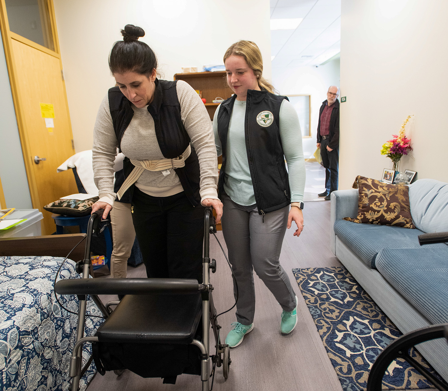 A student works in a nursing simulation lab