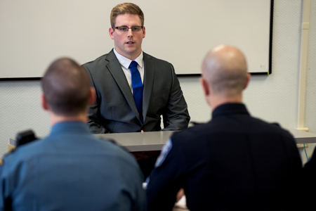 criminal justice administration students meet sin front of an oral board