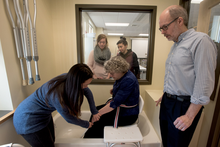 students and faculty working in the occupational therapy lab