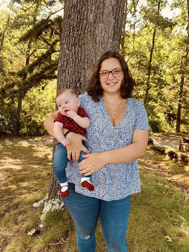 Kimberly holding a baby