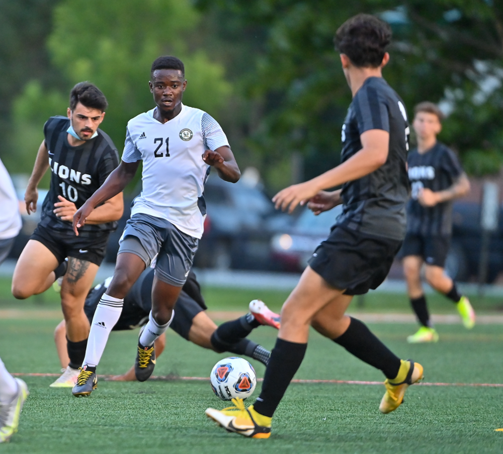 An action shot of Jahmal Williams playing soccer