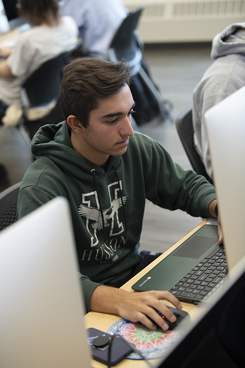 Students attend class in Harold Alfond Hall