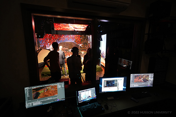 Students and faculty work in the iEX Center on campus at Husson University