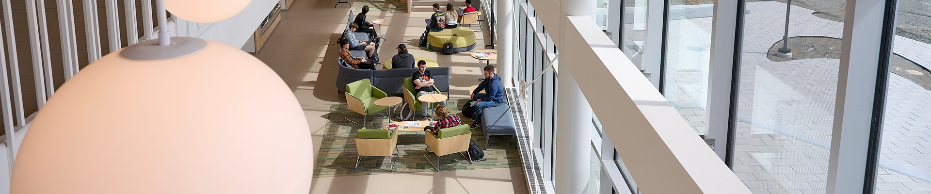 Students walking on campus at Husson University