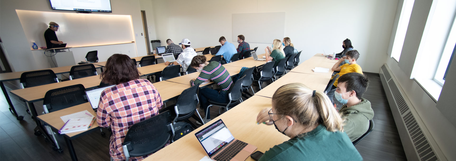 students attend class in the Harold Alfond Hall