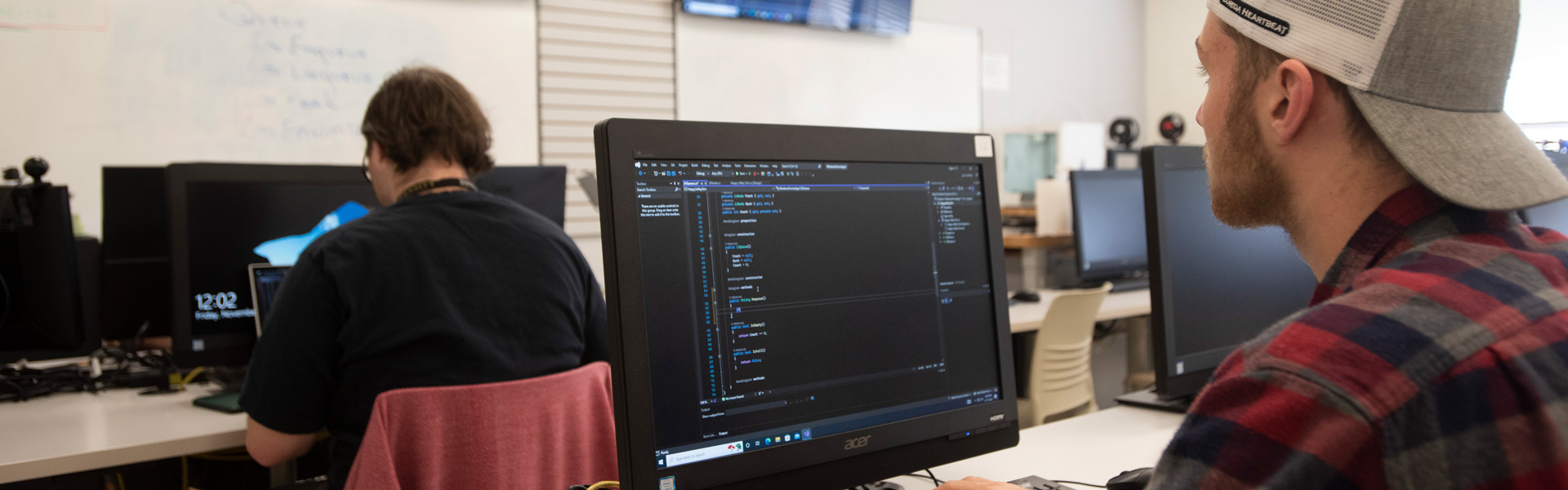 Students work on computer programming during a computer information systems class