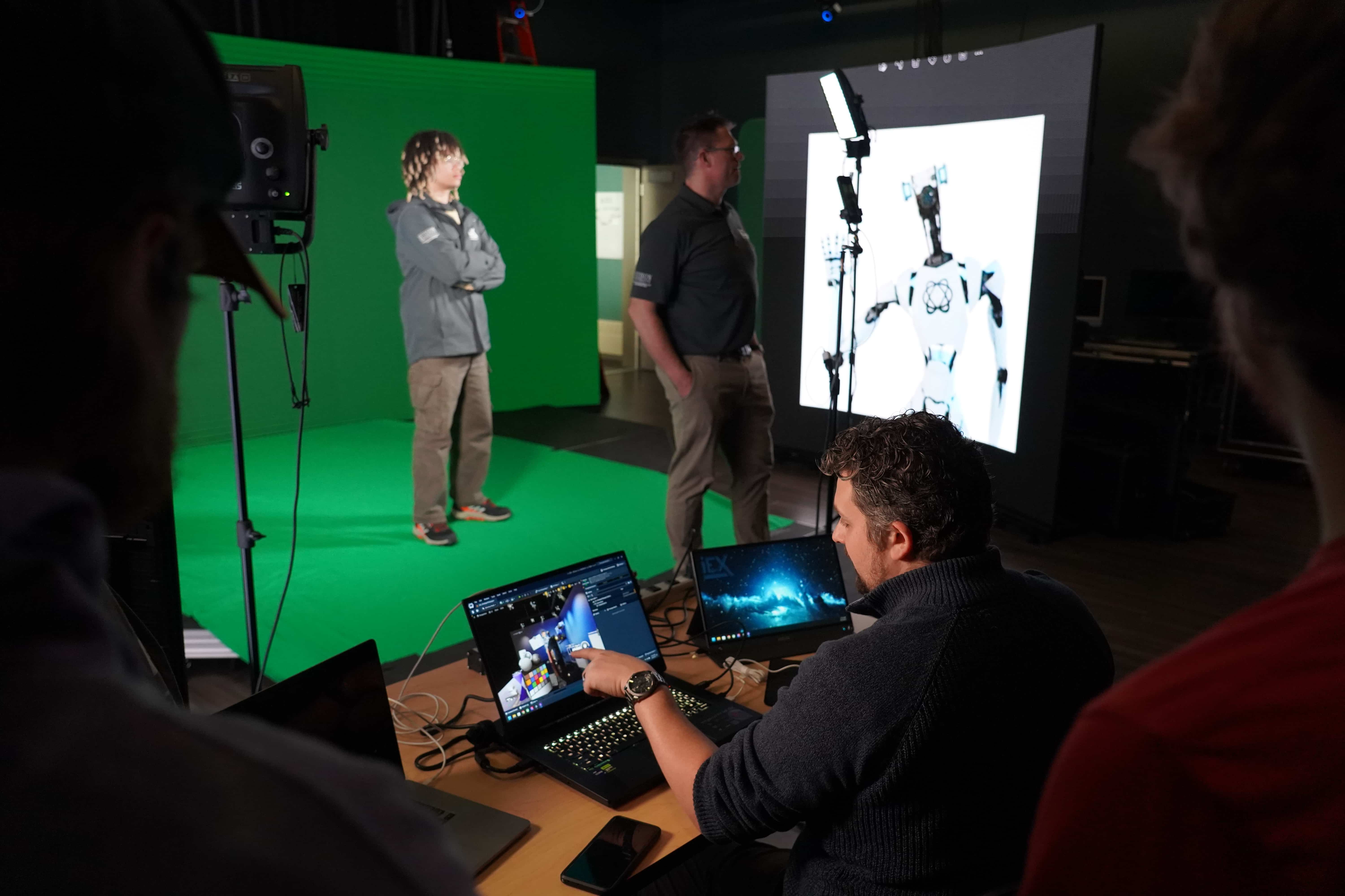 A man pointing at a computer screen.