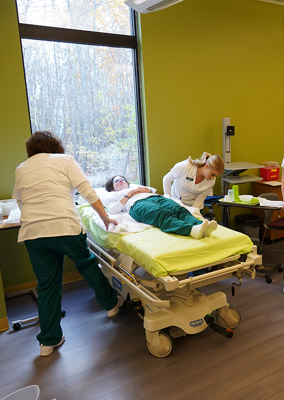 Nursing students work in a simulation lab