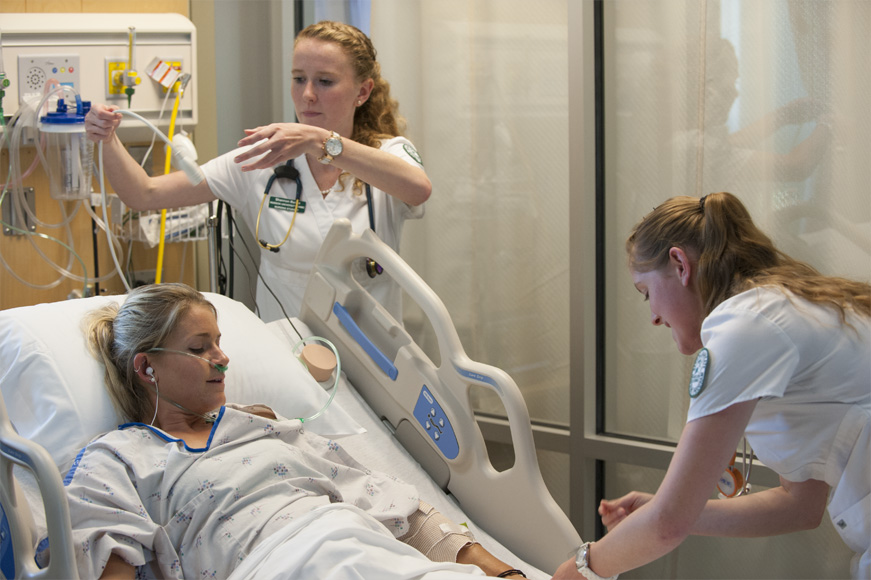 A graduate nursing student listening in class