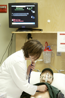 A student using the simulation mannequin