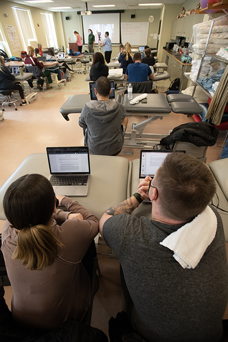 DPT students in the Doctor of Physical Therapy program work in a Physical Therapy simulation lab as part of their physical therapy degree coursework.