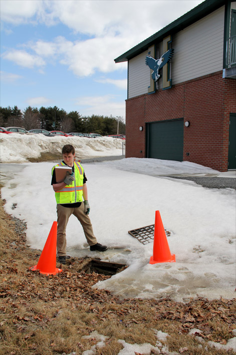 Environmental science student working with sewer drains