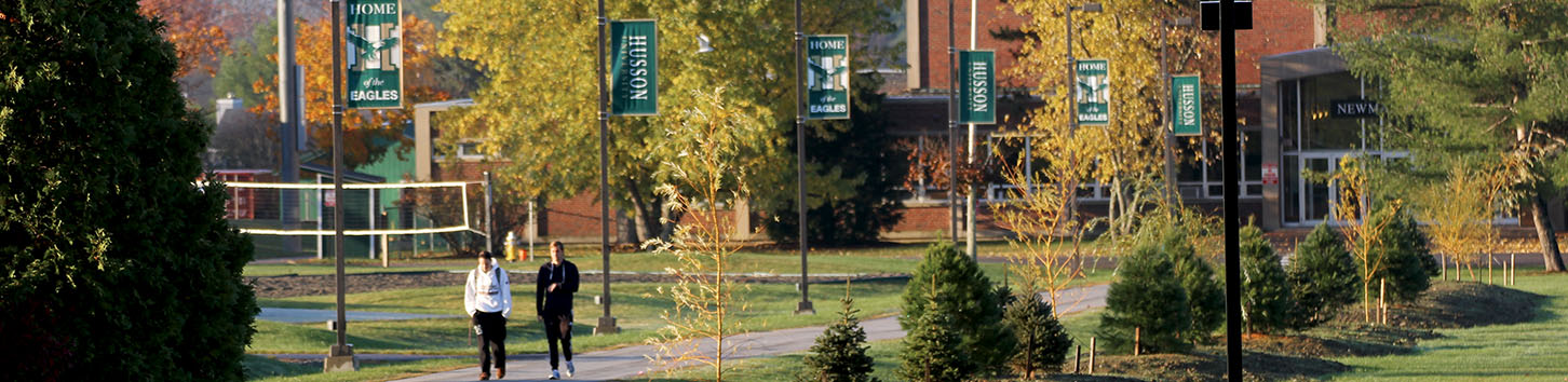Students walking on the campus of Husson University