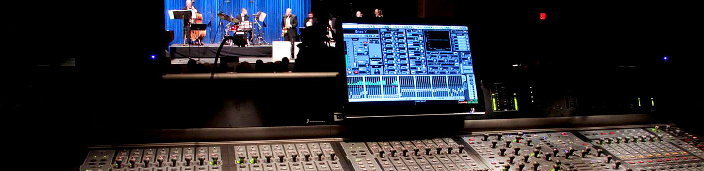 Students work on an audio console at a live performance