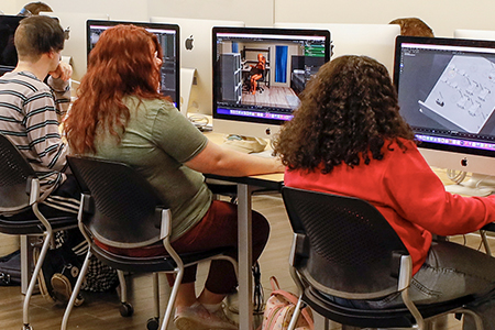 Students work on a graphic design project