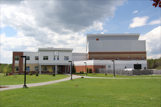 A brick and cement building is shown.