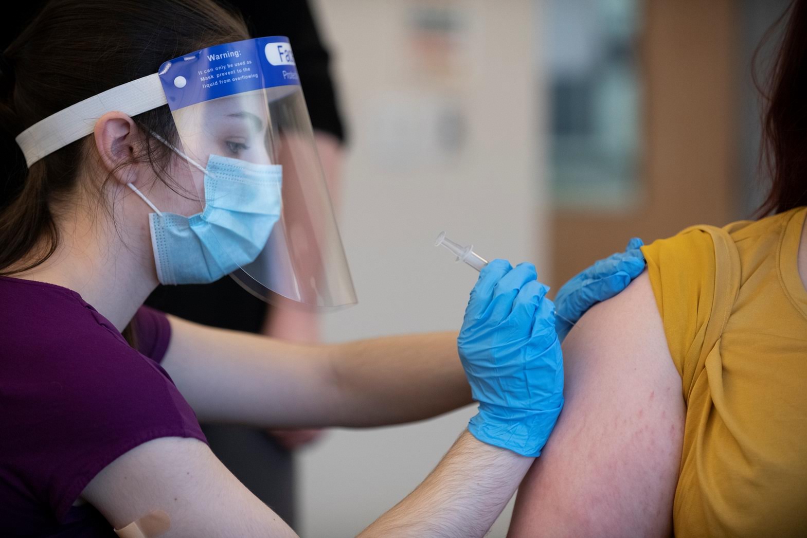 student receiving vaccine