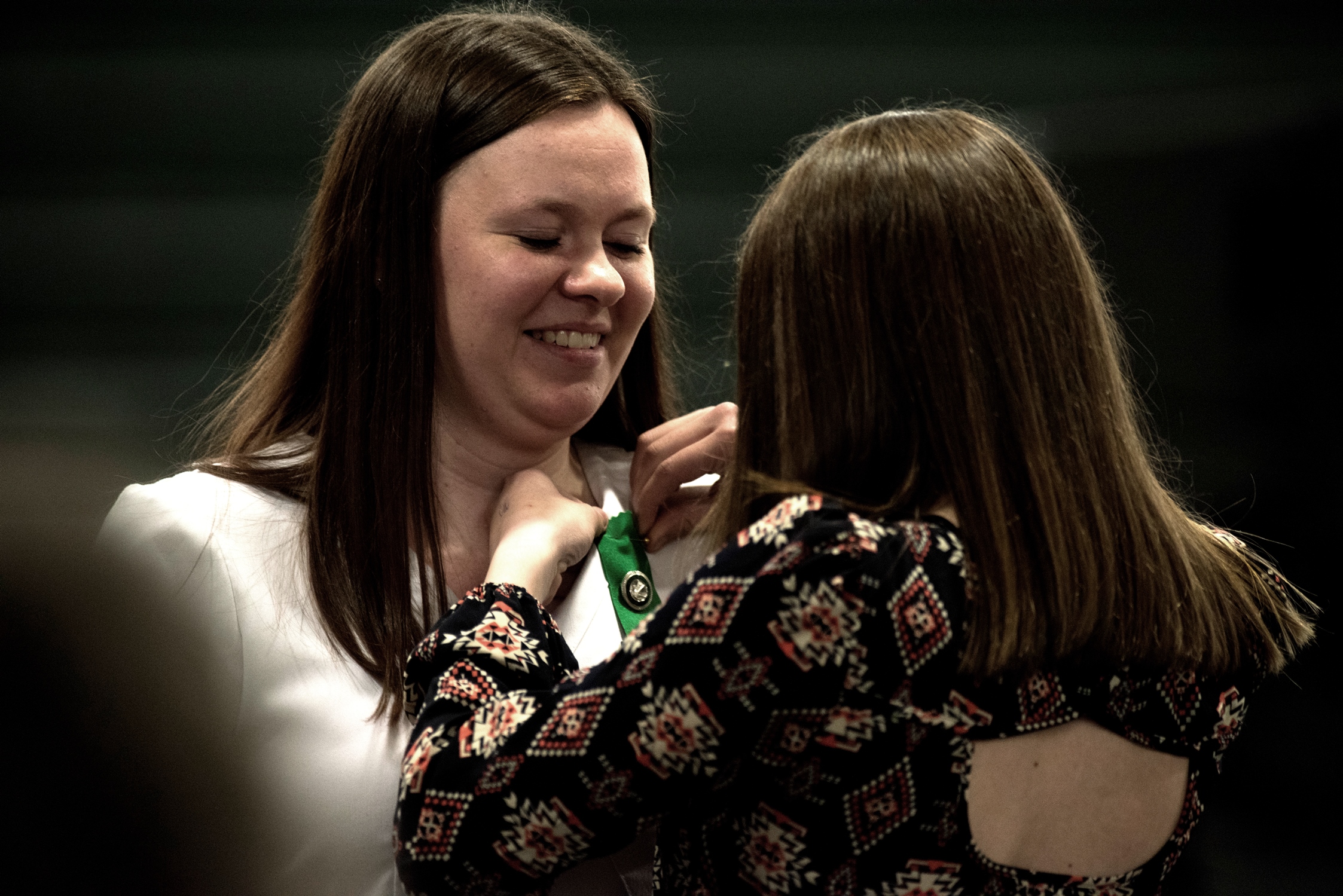 Nurse receiving a pin during the pinning ceremony