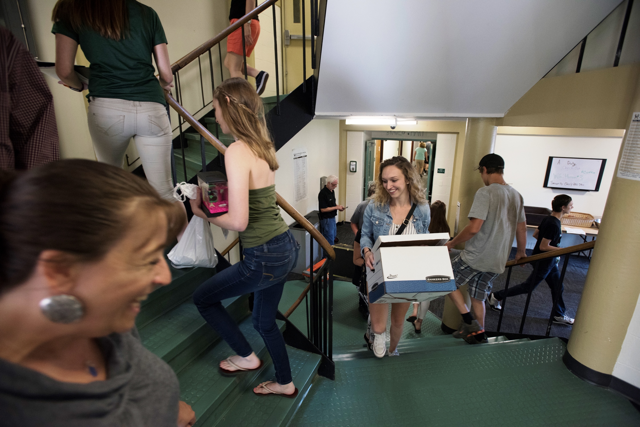Students moving items in to a residence hall