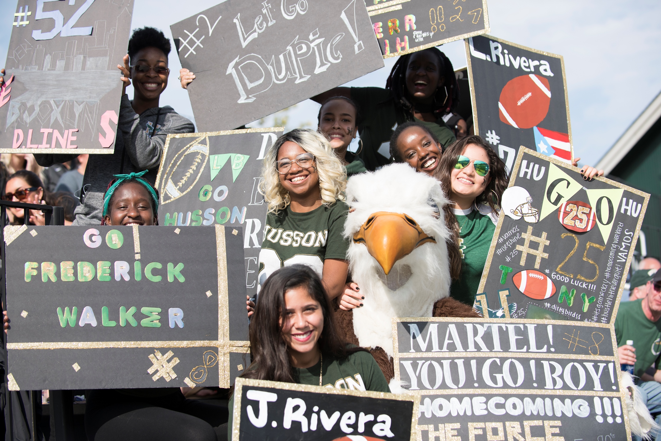 Picture of Homecoming crowd in the stands at a football game