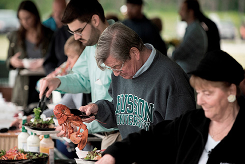 Attendees eat lobster at the annual Celebrate Husson event