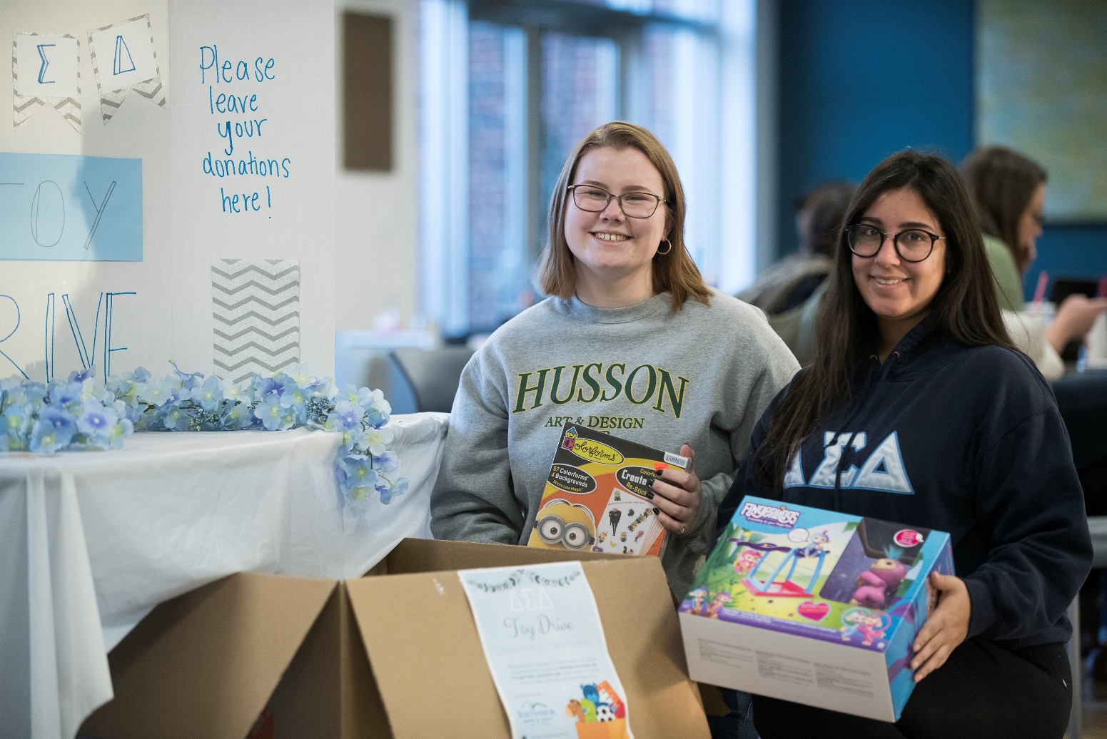 students participate in a toy drive to benefit needy families