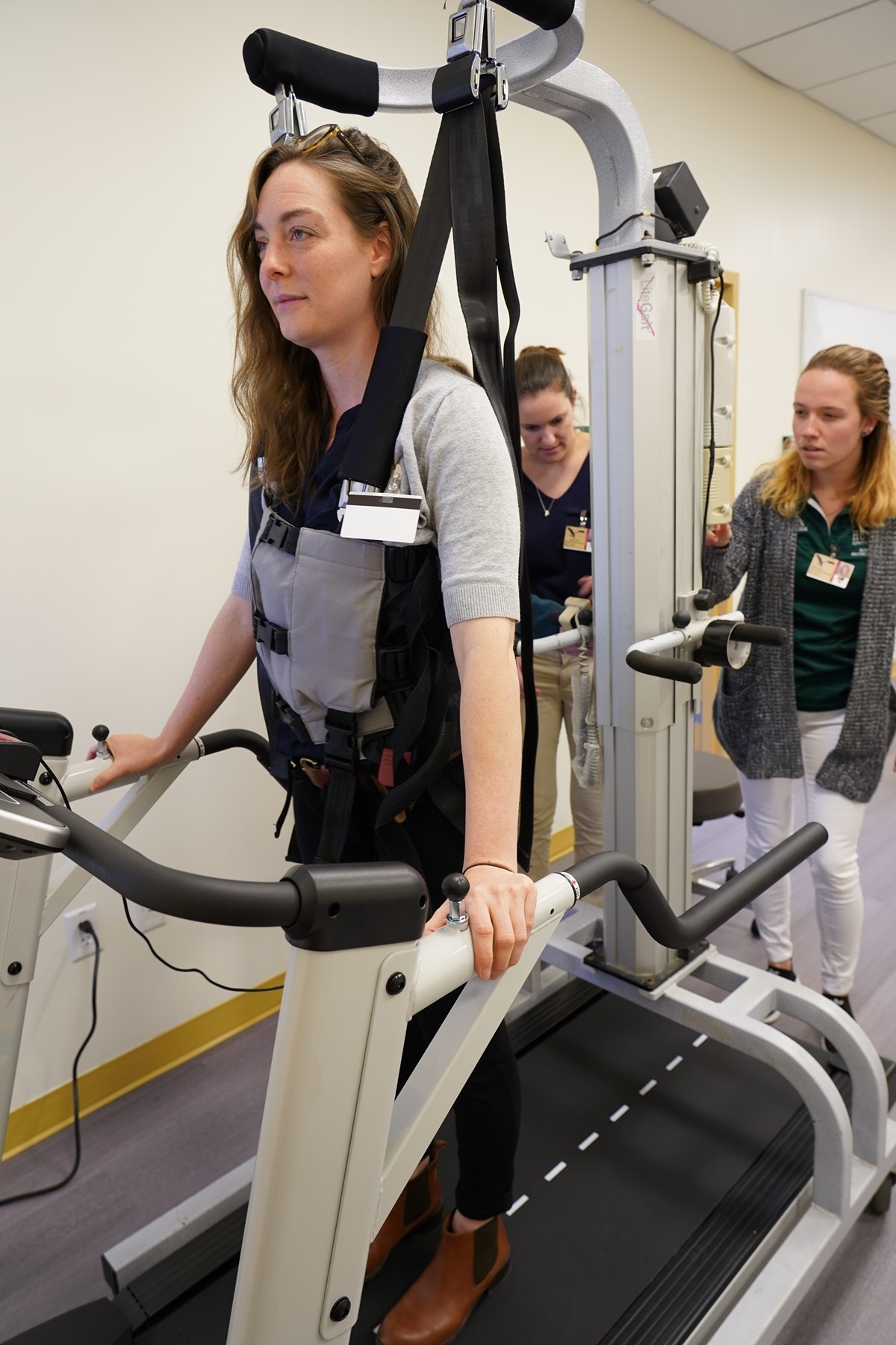 person using physical therapy equipment