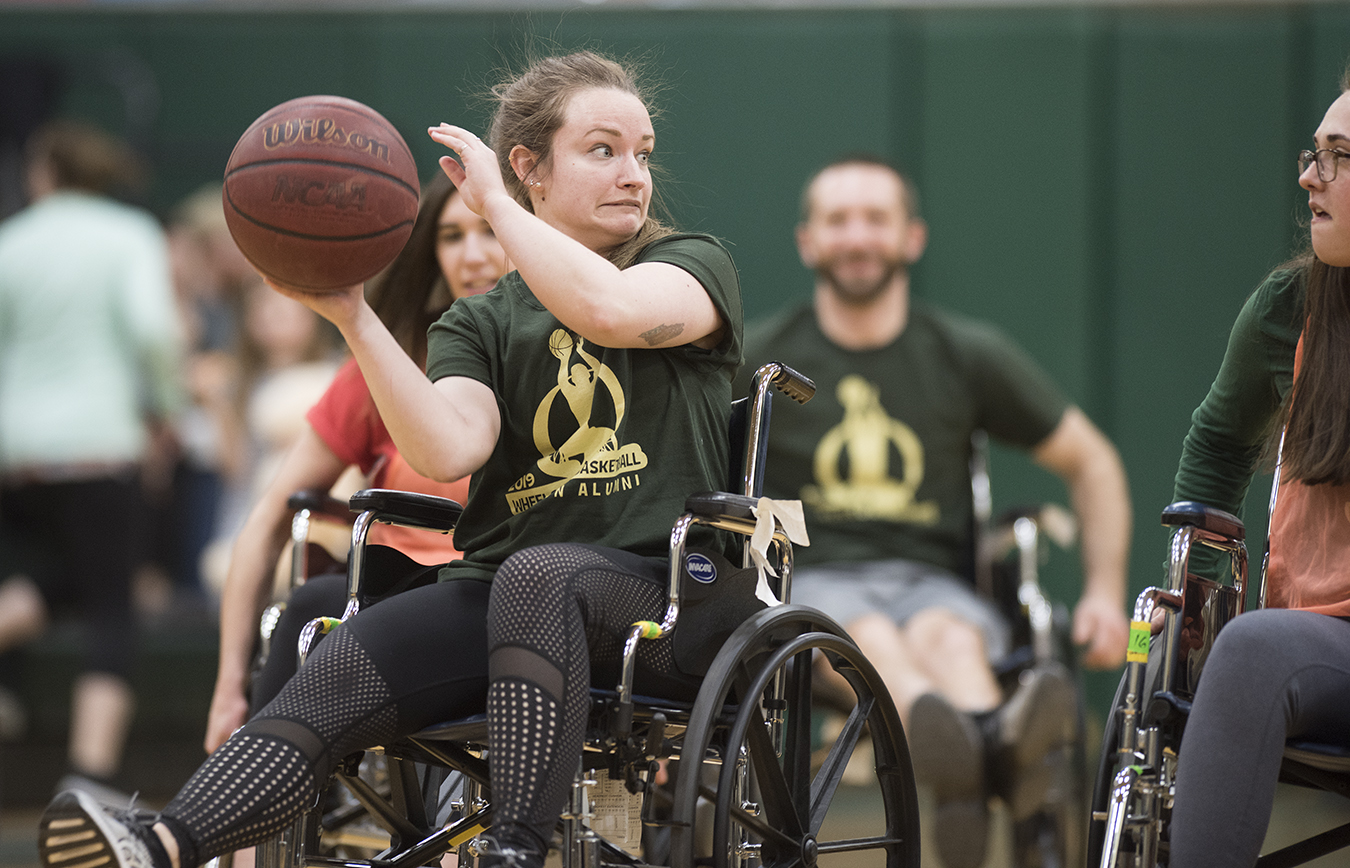 people participating in a wheelchair basketball game