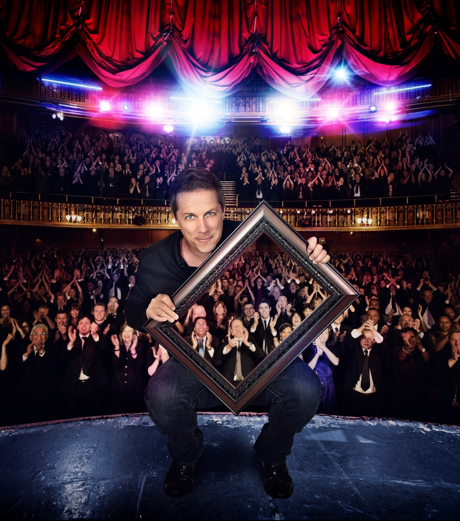 magician creating an illusion in front of an audience inside a theatre