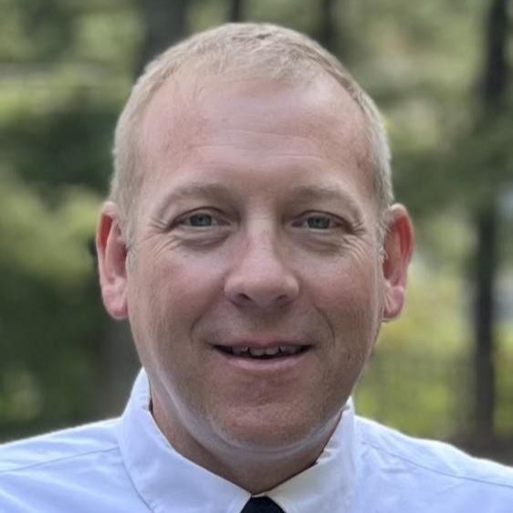 A headshot of a man is shown.