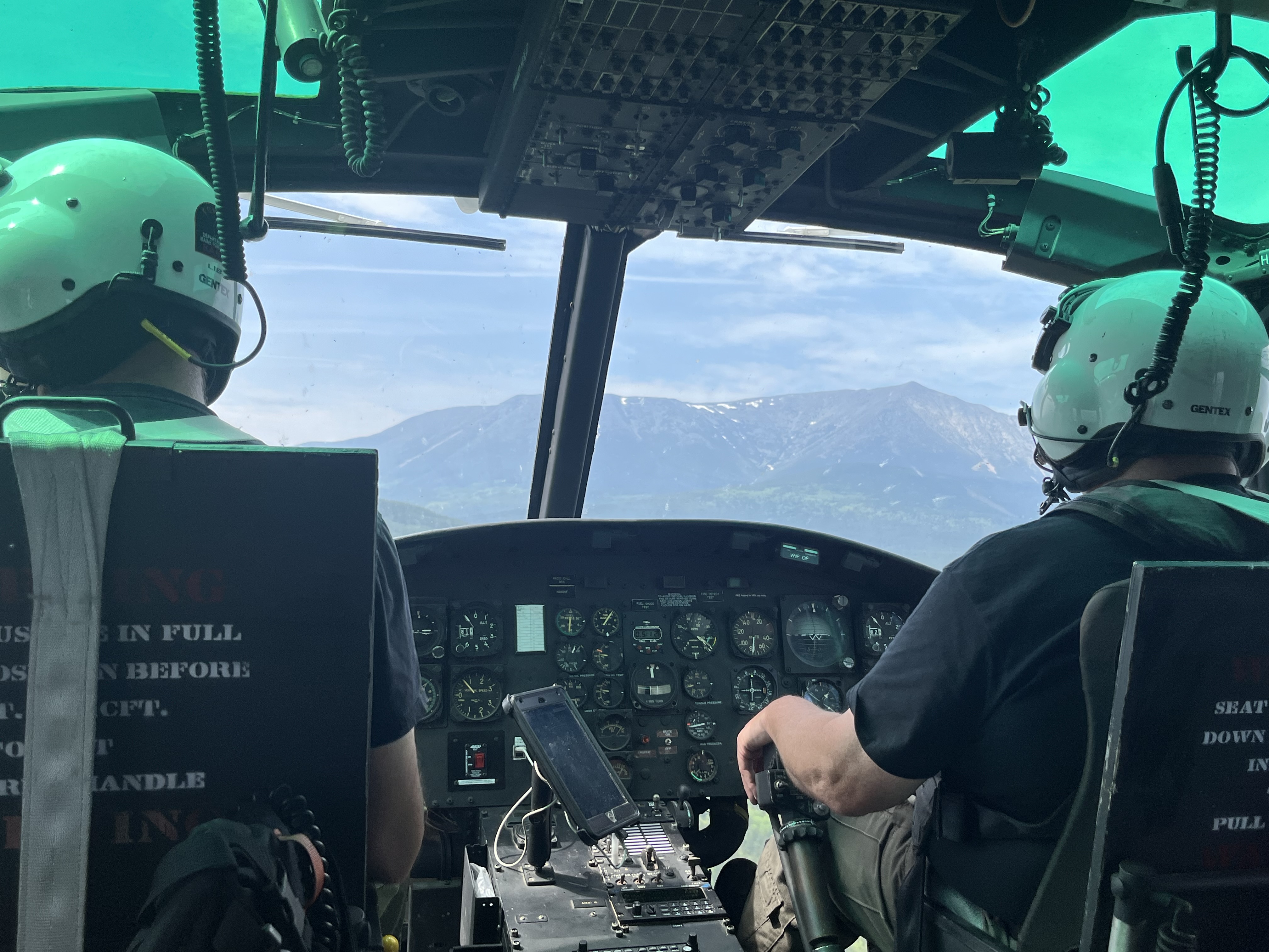The controls and dashboard inside a helicopter are shown.