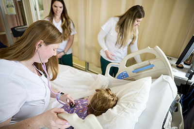 nurses taking care of a patient