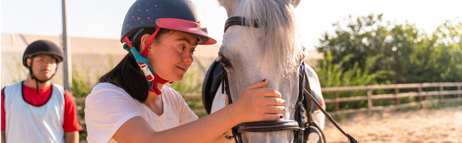 Child petting a horse.